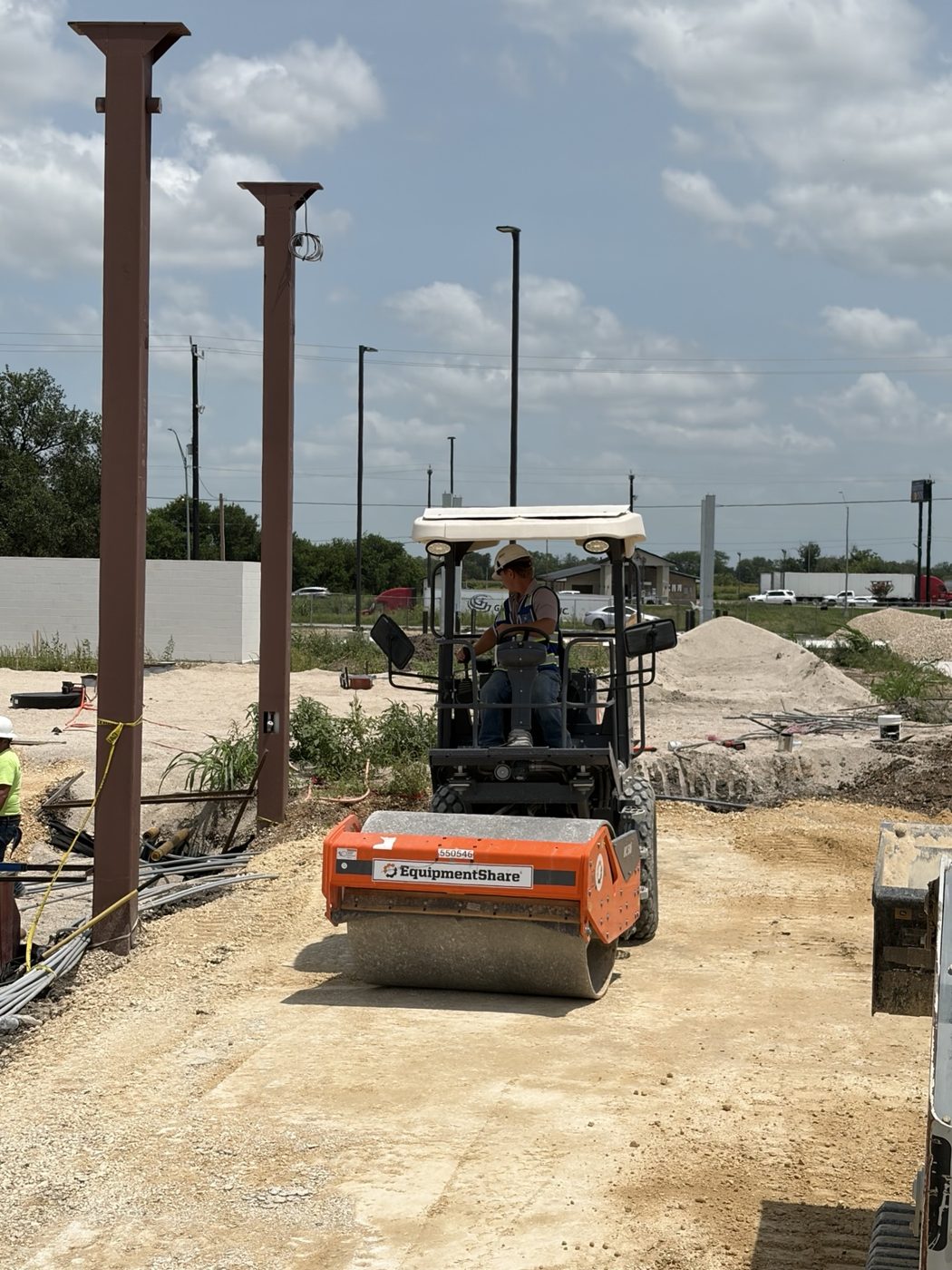 Compaction roller preparing road base