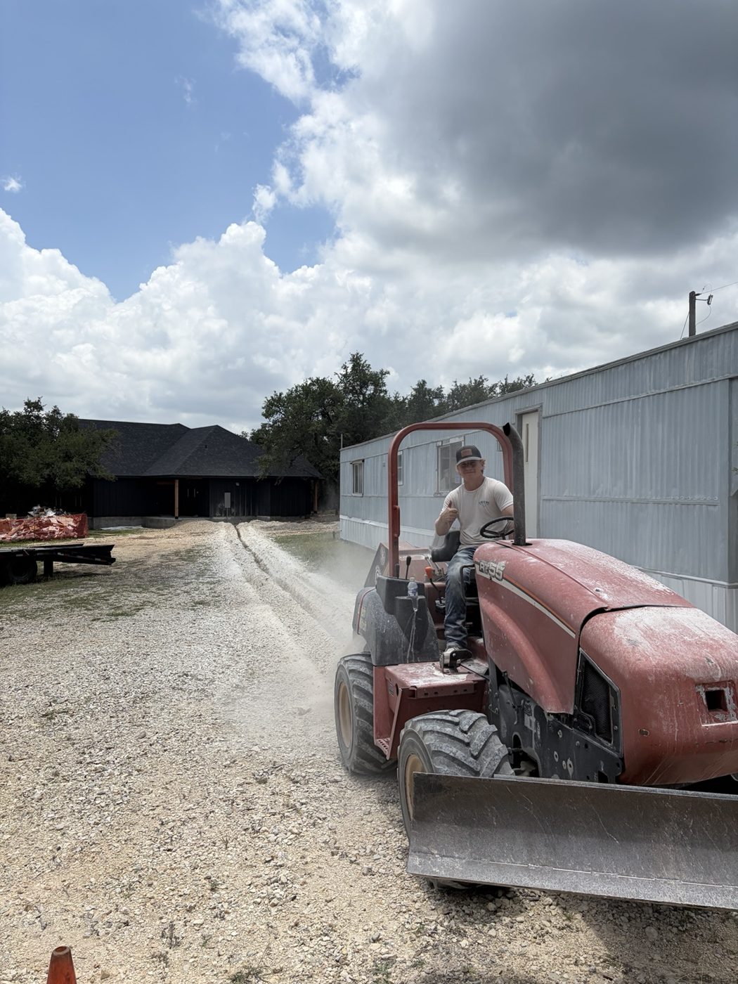 Driveway grading with tractor