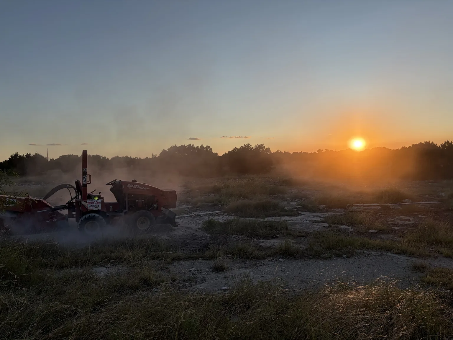 Rock saw trenching at sunset