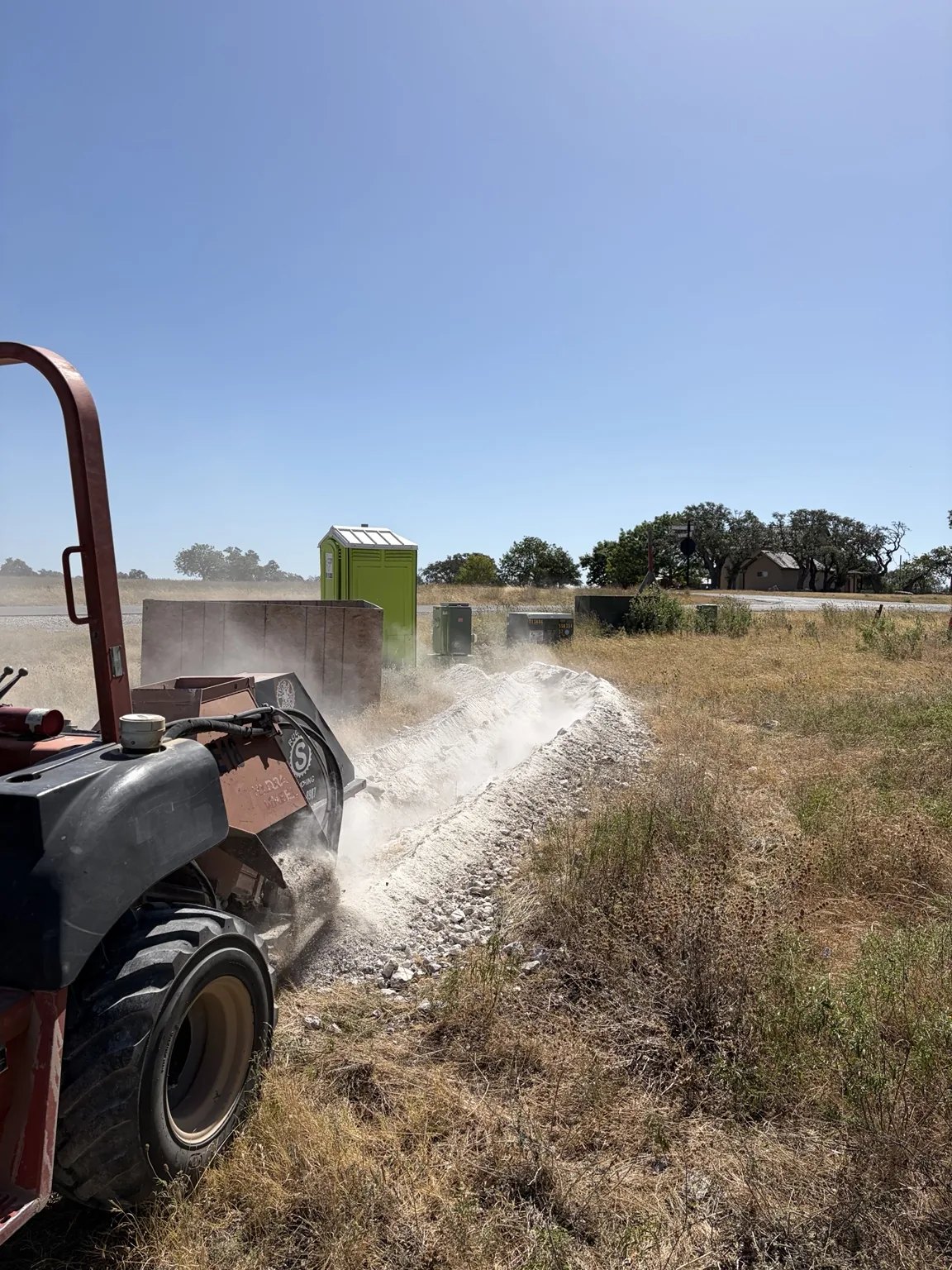 Rock saw trenching through limestone in Central Texas